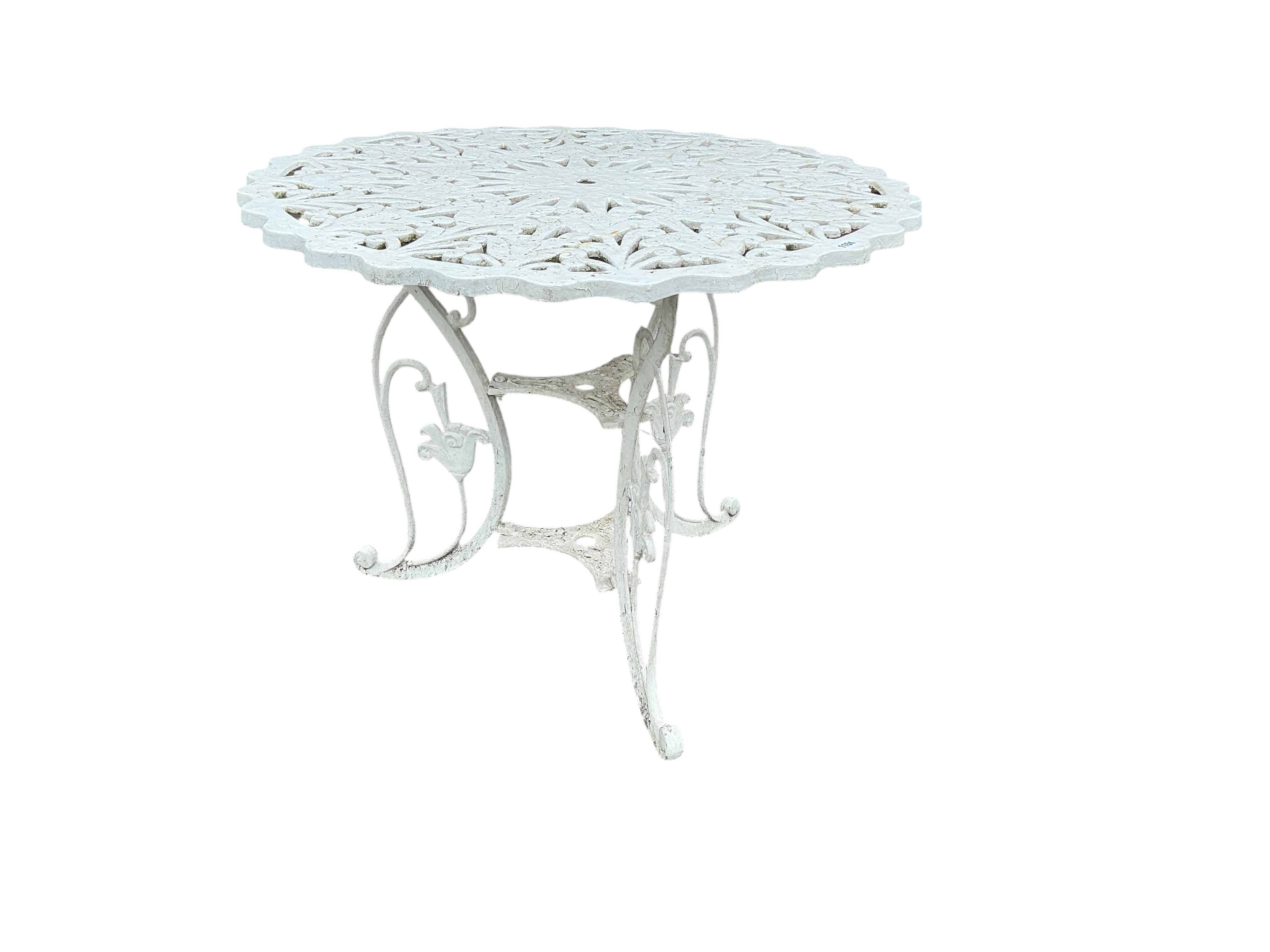 A Victorian style circular aluminium garden table, diameter 89cm, height 70cm and six chairs